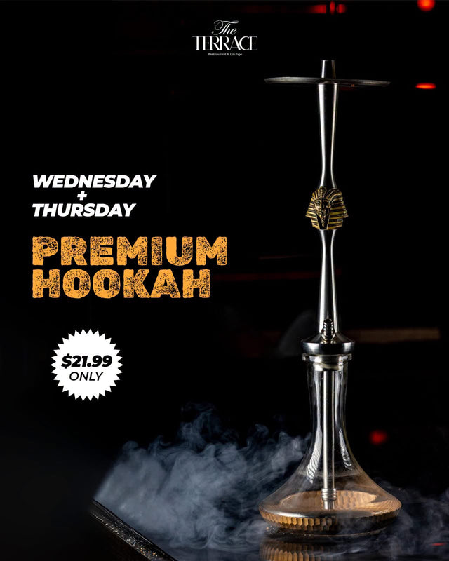 A premium hookah with a gold pharaoh detail, lit in red