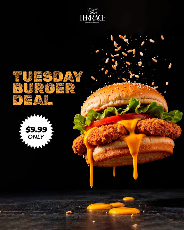 A crispy chicken burger with lettuce, tomato and melted cheddar
